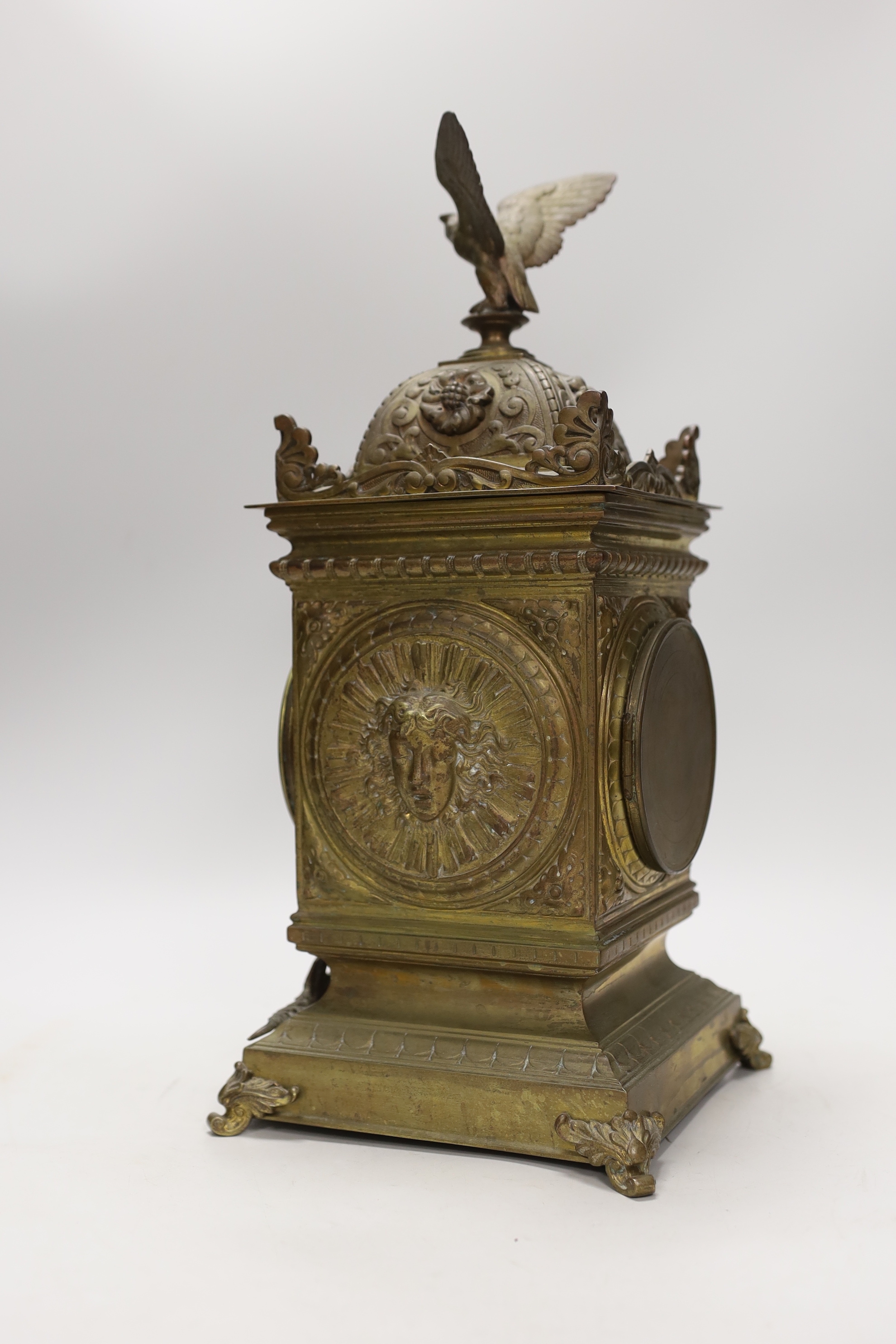 A French brass eagle mounted mantel clock, with ornate dial, 41cm high